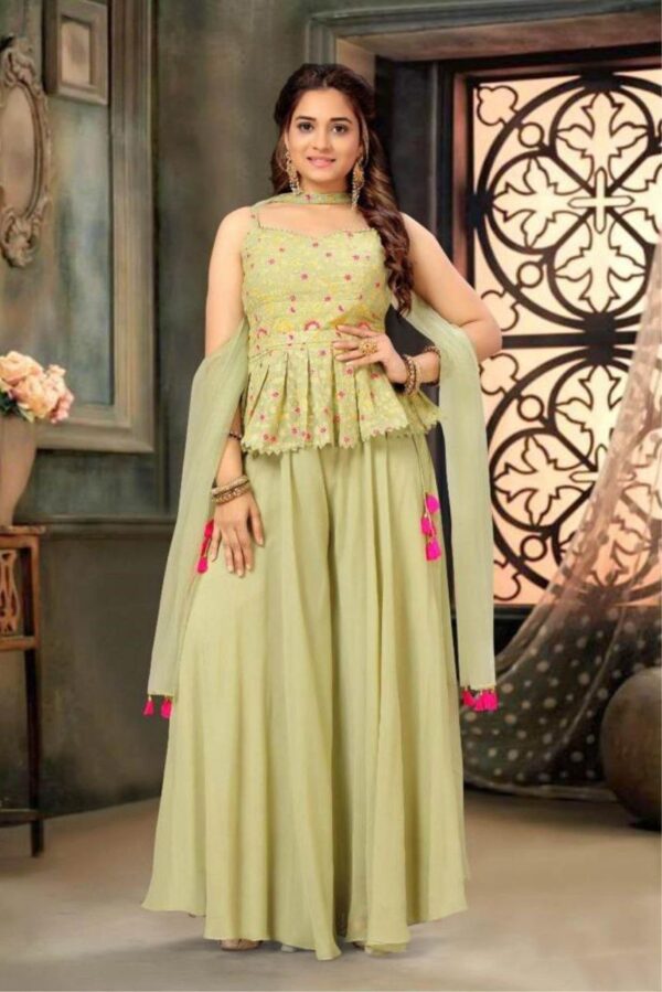 Elegant Green Ethnic Outfit with Pink Tassels for Festive Vibes